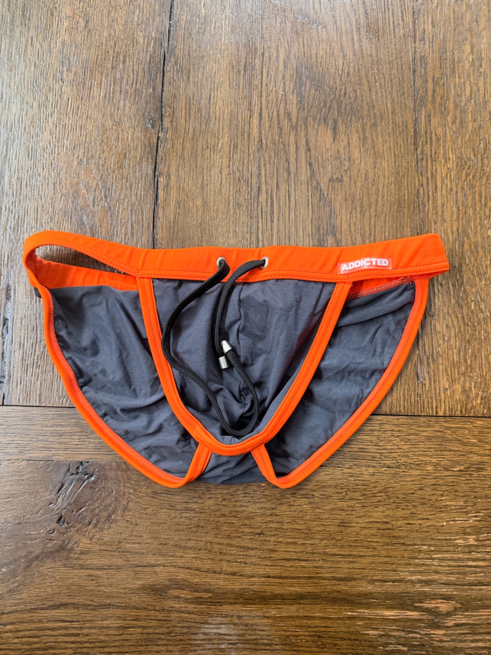 Addicted Brands Men's Swim Brief in Orange and Charcoal Gray